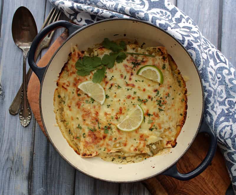 overhead view green chicken enchiladas in baking dish