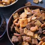small copper bowl piled high with buffalo ranch snack mix