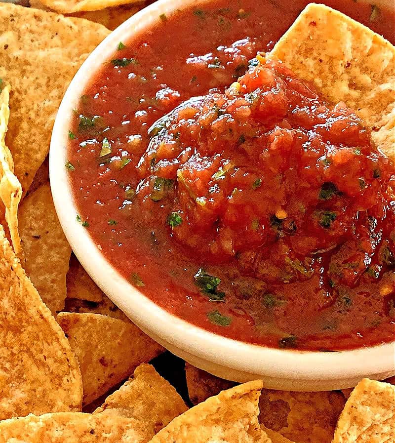 white bowl with refrigerator salsa and tortilla chip