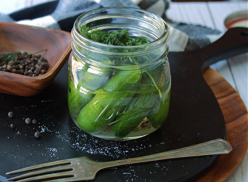 side view of refrigerator dill pickles in a mason jar 