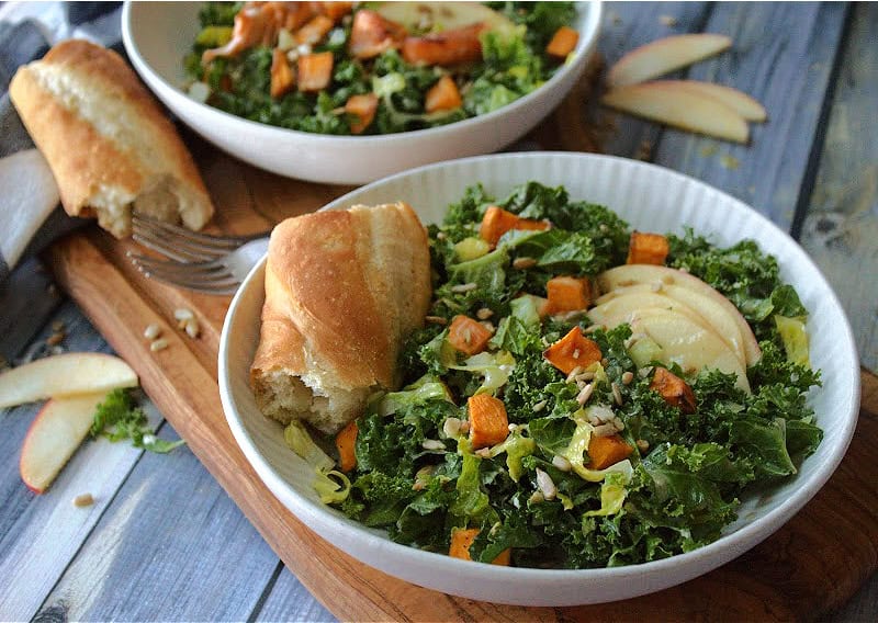 w white bowls with fall kale salad and hunk of crusty bread