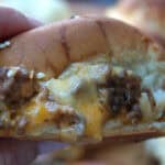 closeup of air fryer sliders with melty cheese