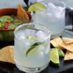 classic margarita recipe - 2 salt rimmed glasses garnished with lime