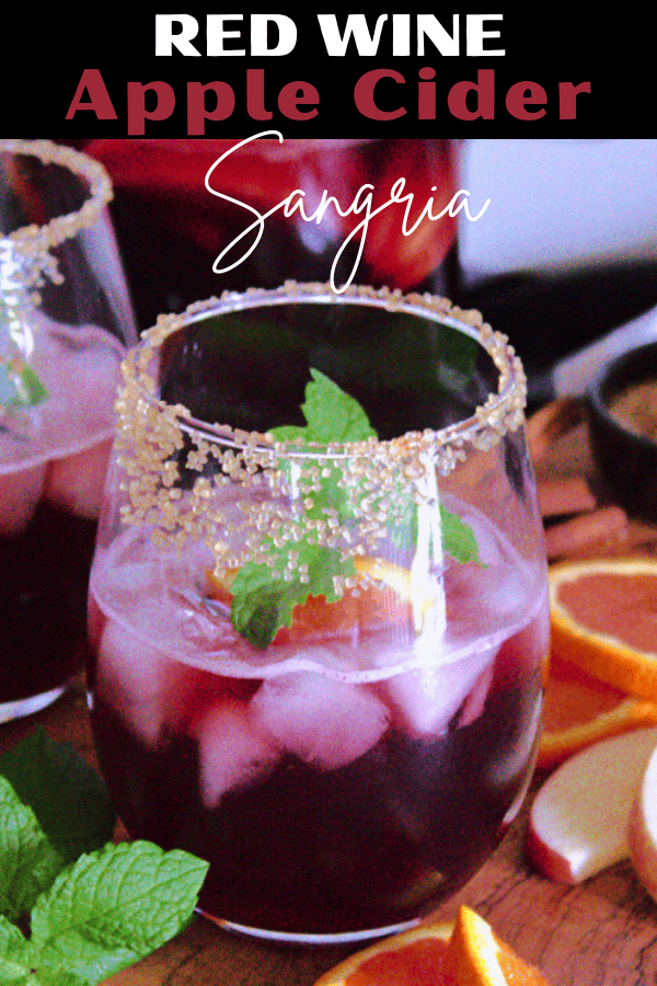 pinterest pin for thanksgiving sangria showing 2 glasses of sangria