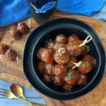 overhead view - black bowl with 3 ingredient meatballs and toothpicks