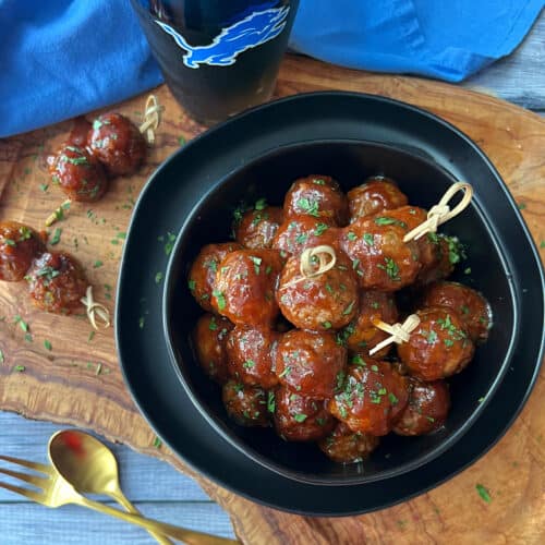 overhead view - black bowl with 3 ingredient meatballs and toothpicks