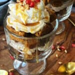 individual clear glass trifle dish with pumpkin bread trifle topped with whipped cream and caramel