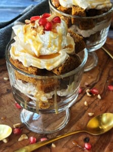 individual clear glass trifle dish with pumpkin bread trifle topped with whipped cream and caramel