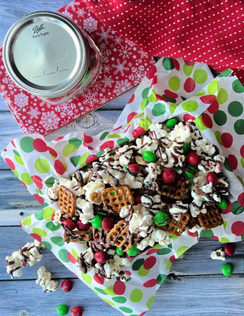overhead view of Christmas Popcorn in festive red and white tin
