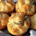 close up of focaccia muffins with fresh rosemary