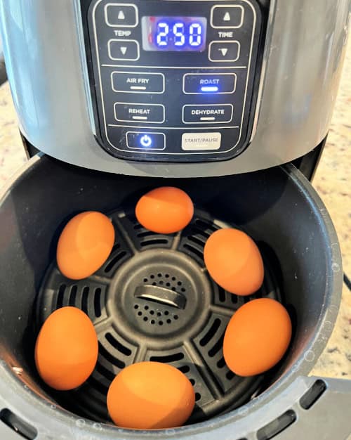 air fryer hard boiled eggs shown in a ninja air fryer