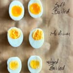 overhead view of sliced hard, medium and soft boiled eggs for air fryer hard boiled eggs post
