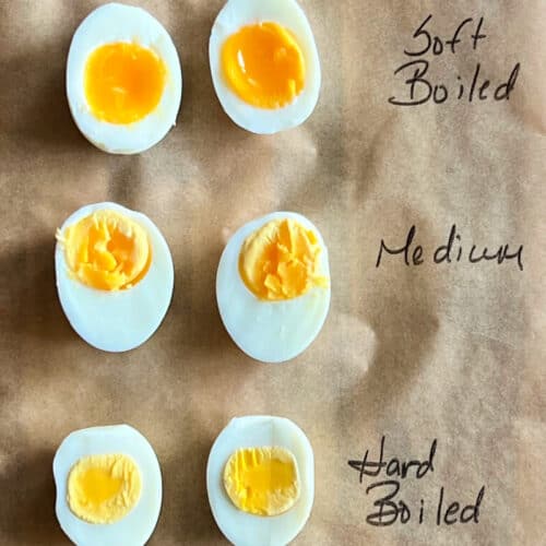 overhead view of sliced hard, medium and soft boiled eggs for air fryer hard boiled eggs post