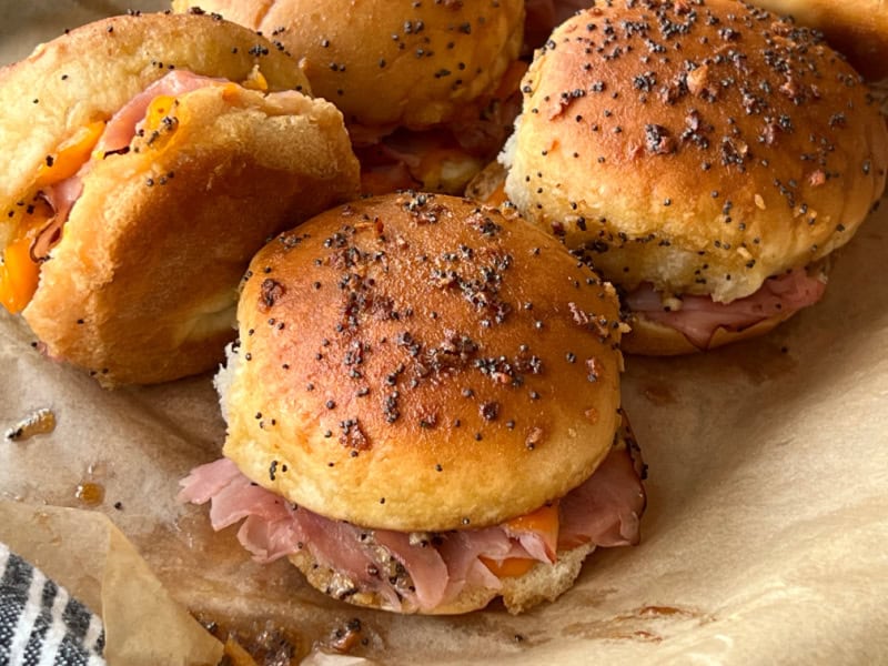 closeup of baked ham and cheese sliders