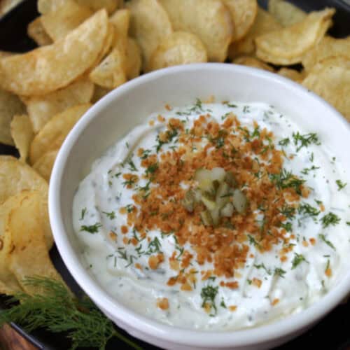 overhead view - white bowl with dill pickle ranch dip topped with golden panko crumbs