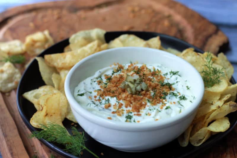 white bowl with dill pickle ranch dip topped with crispy golden panko bread crumbs