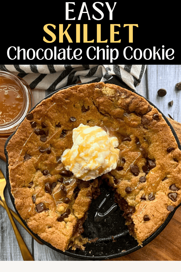 overhead view - skillet chocolate chip cookie in cast iron skillet and jar of caramel sauce alongside it