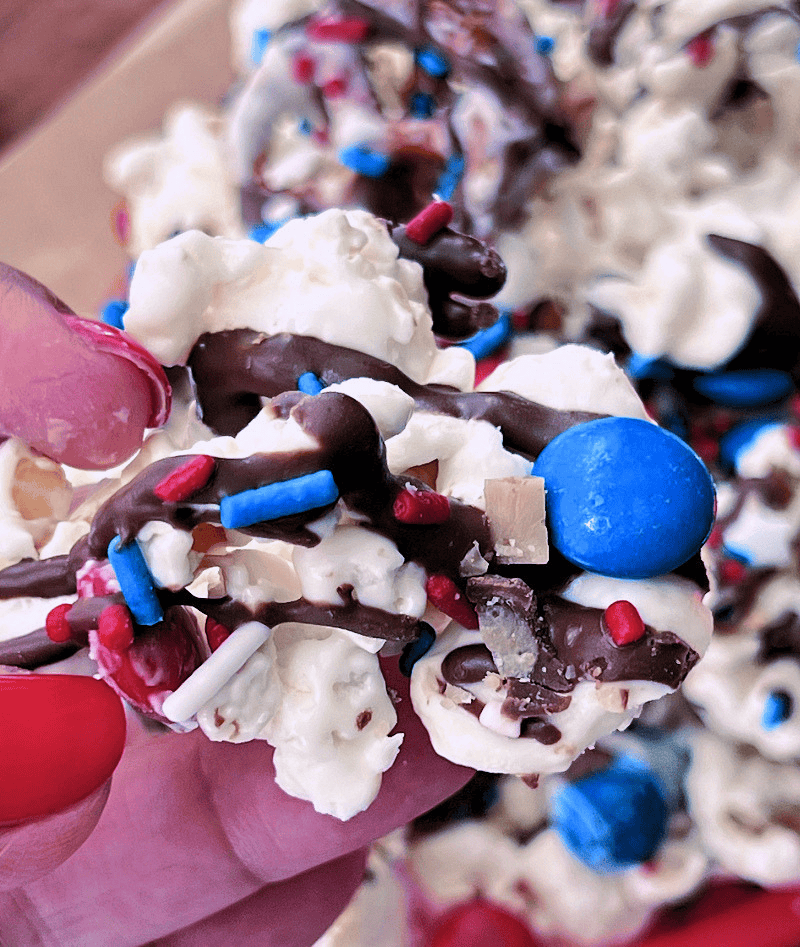 closeup of 4th of July popcorn with red white and blue m&ms