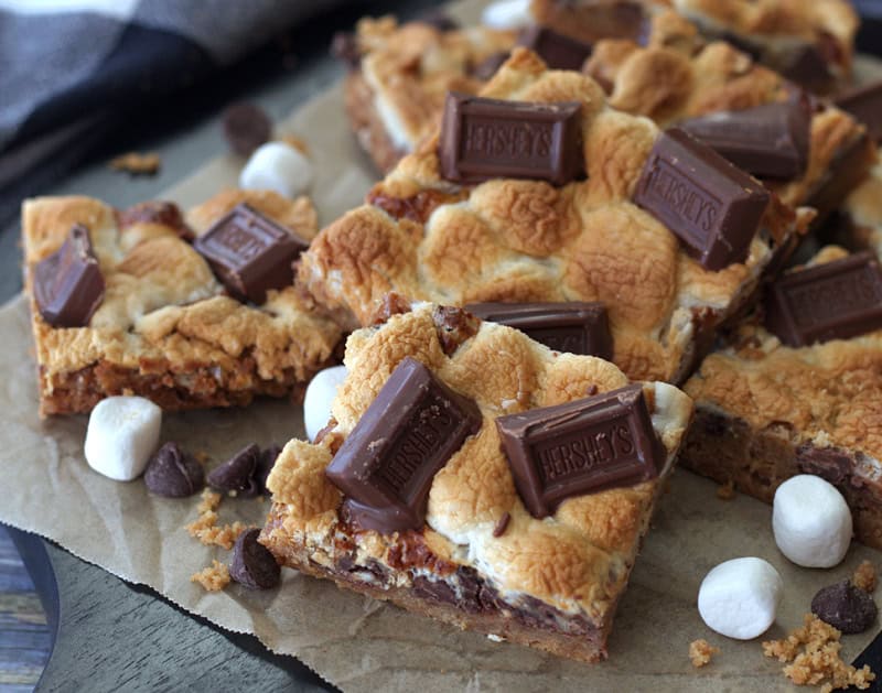overhead view - smores cookie bars with mini hershey bars pressed into the top of them.