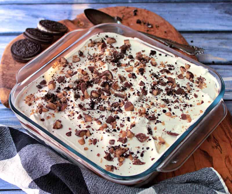 overhead view chocolate lasagna in baking dish topped with english toffee bits