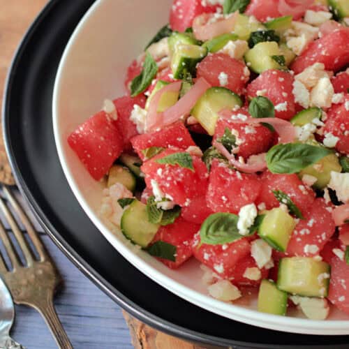 closeup of watermelon feta salad in white bowl