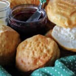 basket with air fryer biscuits and a jar of jam