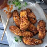 overhead view white plate with Air Fryer Buttermilk Chicken Tenders and dipping sauce