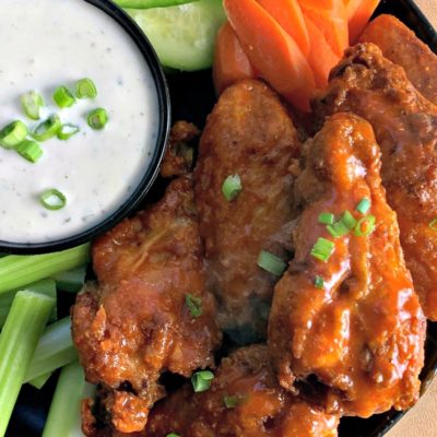 plate of air fryer chicken wings with ranch for dipping