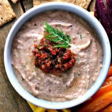 Black Eyed Pea Hummus ~ simple, healthy, creamy black eyed pea hummus topped with a dollop of tomato chow chow relish. Eating black eyed peas New Year's Day is said to bring luck all year.