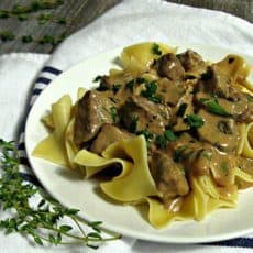 The Best Beef Stroganoff ~ tender beef simmered in a delicious sour cream/mushroom sauce with fresh herbs and a hint of Dijon mustard all over egg noodles.