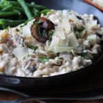 how to make jar alfredo sauce taste better shown with sauteed mushrooms
