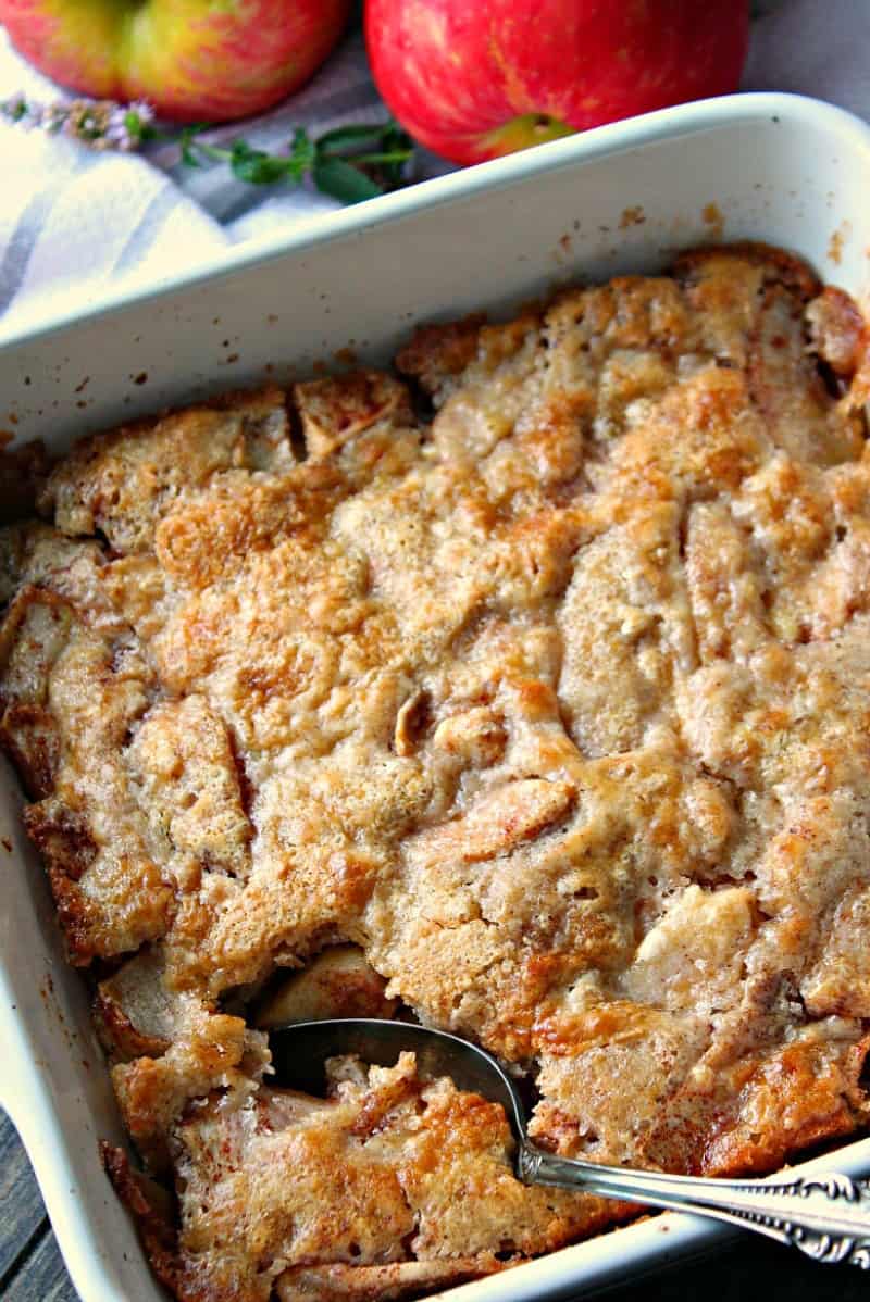 white baking dish with apple cobbler
