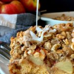 slice of cinnamon roll apple crisp with mid-air drizzle of white icing