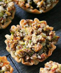 closeup of mini baklava cup on wood board