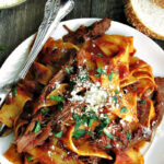 overhead view braised beef ragu with pappardelle