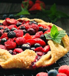closeup of Mixed Berry Galette garnished with fresh mint leaves