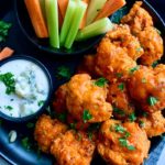 buffalo cauliflower bites served with ranch, carrots and celery