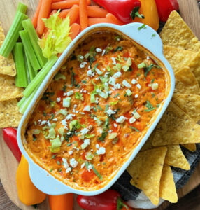 overhead view white baking dish with healthy buffalo chicken dip