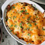 Cheesy Cauliflower Casserole in white baking dish