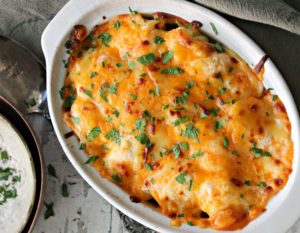 Cheesy Cauliflower Casserole in white baking dish