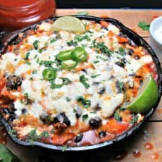 One Pan Chicken Enchilada Casserole. Flavored chicken, beans and tortillas layered and topped with cheese. Weeknight or + margaritas for easy entertaining!