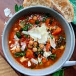 overhead view easy garbanzo bean soup garnished with shaved parmesan cheese