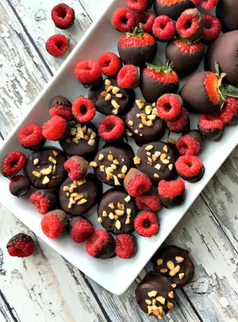 white platter with chocolate dipped fruit
