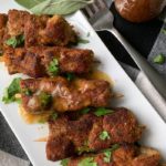 overhead view white platter with breaded city chicken
