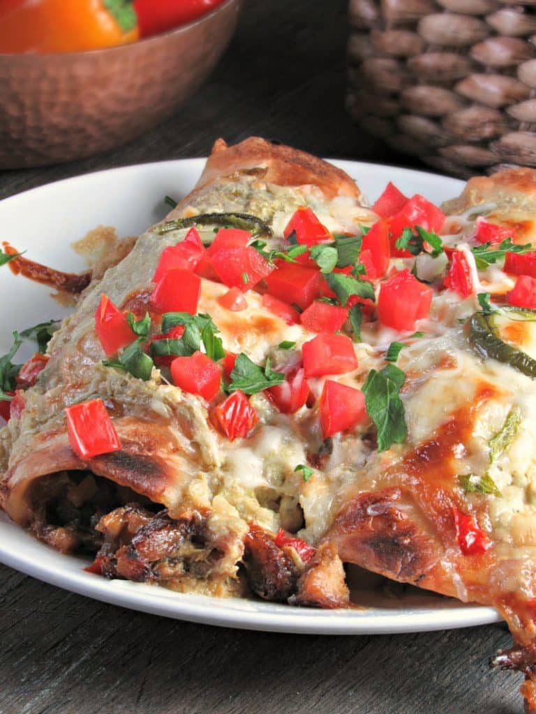 Salsa Verde Enchiladas packed with pork Carnitas OR rotisserie chicken, topped with creamy salsa verde sauce & cheese baked until golden brown. 