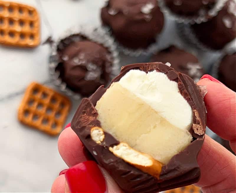 closeup of frozen chocolate banana yogurt bites cut in half showing inside it