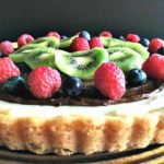 fruit tart recipe ~ sugar cookie crust layered with cheesecake filling, nutella and finished with fresh fruit.