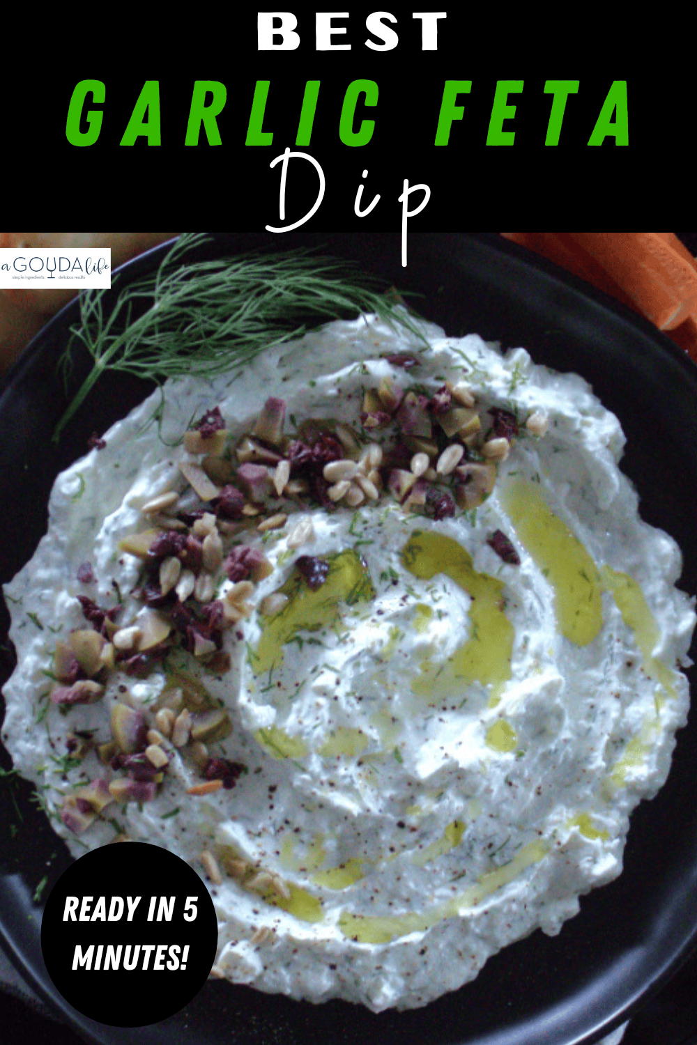 pinterest pin showing black plate with garlic feta dip garrnished with diced olives