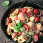 greek tortellini pasta salad ~ 3 cheese tortellini combined with vegetables, olives, herbs and feta cheese blended with a simple homemade Greek Yogurt Greek dressing.