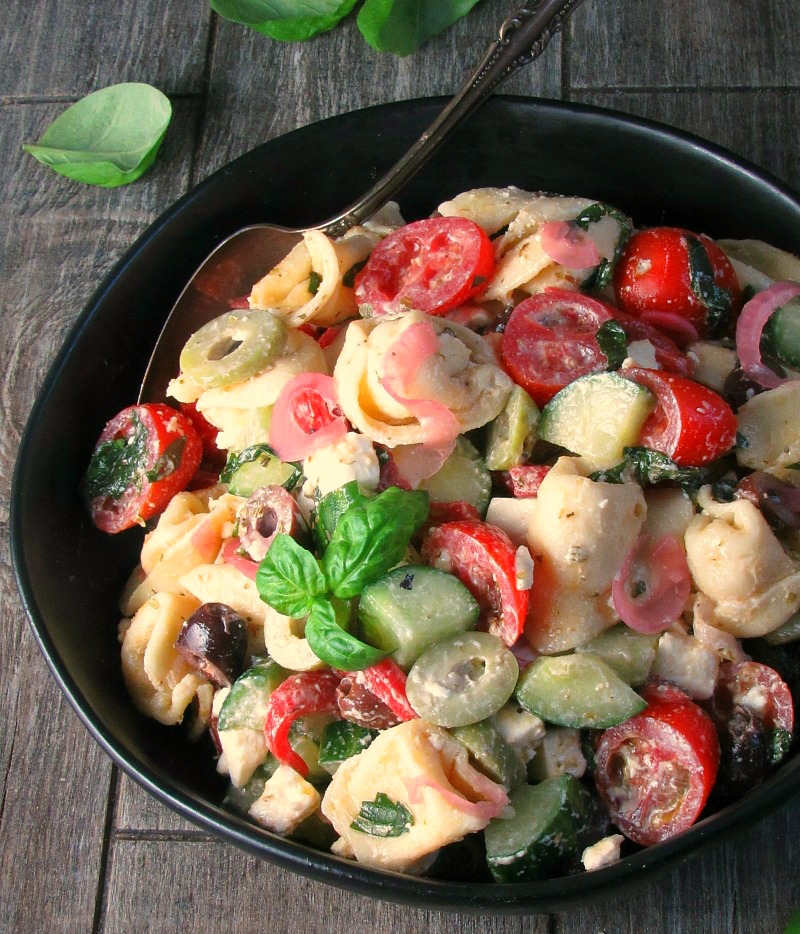 greek tortellini pasta salad ~ 3 cheese tortellini combined with vegetables, olives, herbs and feta cheese blended with a simple homemade Greek Yogurt Greek dressing.